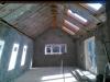 Kitchen as viewed from Utility room with doors leading out to garden courtyard and 4 velux windows by DKM Consultants